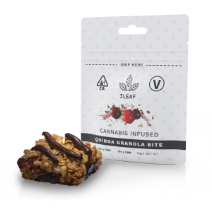 3Leaf Vegan Quinoa Granola Bite. One bite placed in front of the 3Leaf package.