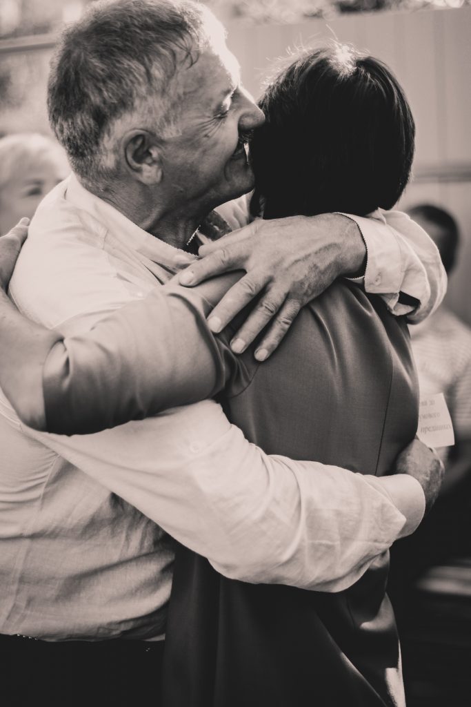 Couple hugging each other.